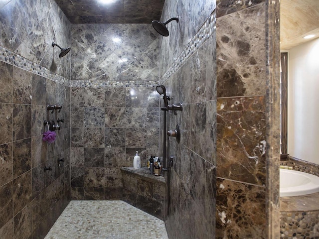 bathroom with tiled shower