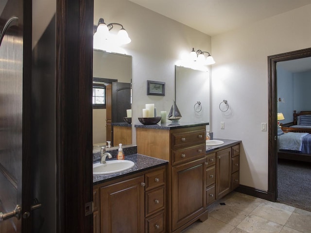 bathroom featuring dual vanity and tile floors