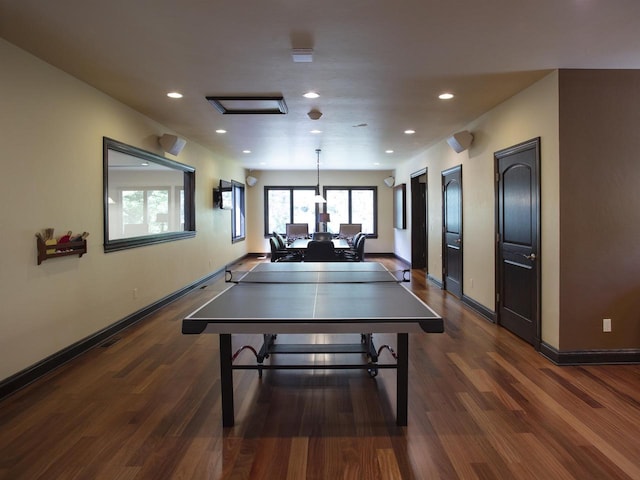 playroom featuring a healthy amount of sunlight and dark hardwood / wood-style flooring