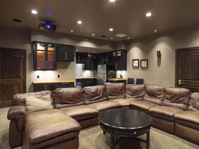 carpeted living room featuring bar