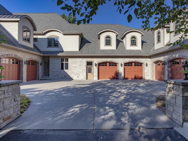 french country home featuring a garage