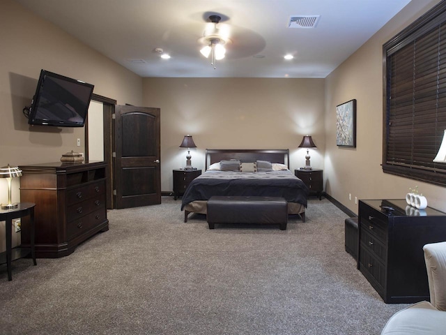 bedroom with ceiling fan and light colored carpet