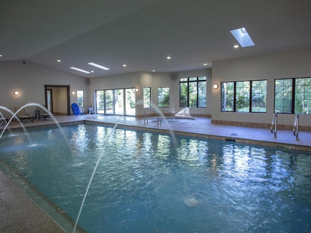 view of swimming pool featuring a skylight