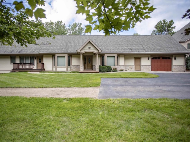 single story home with a front yard and a garage