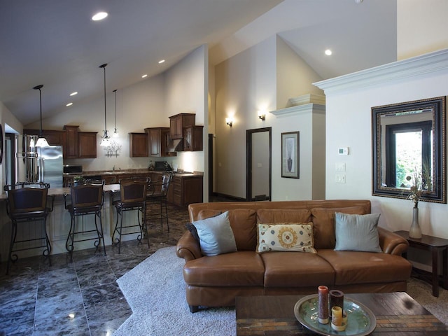 tiled living room featuring high vaulted ceiling, sink, and a chandelier