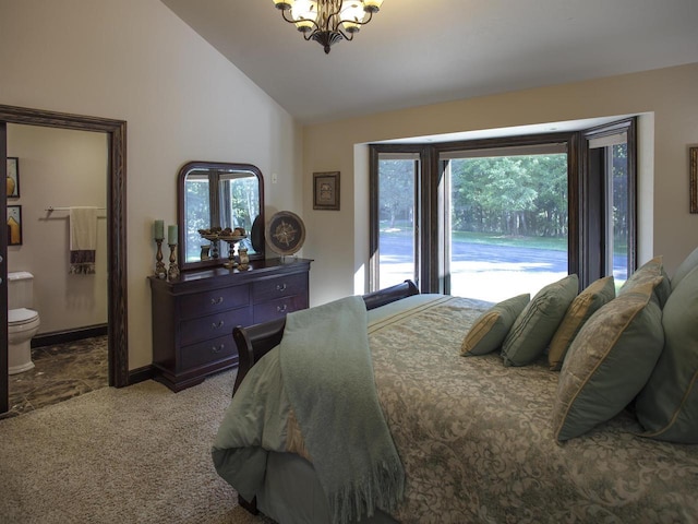 tiled bedroom featuring a chandelier, ensuite bath, multiple windows, and high vaulted ceiling