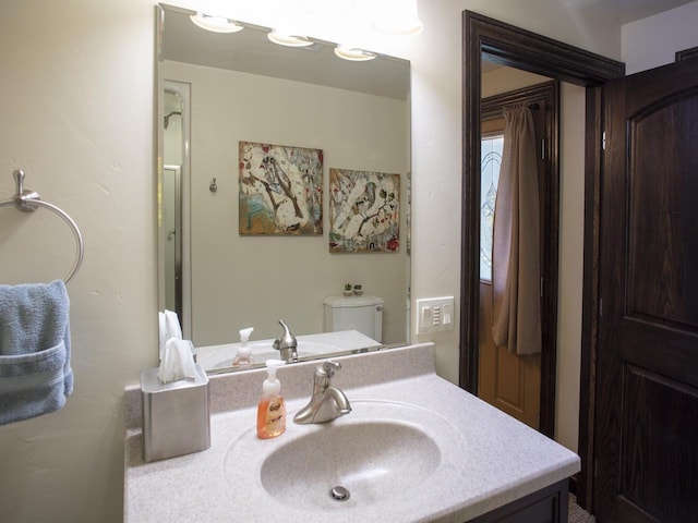 bathroom with vanity and toilet