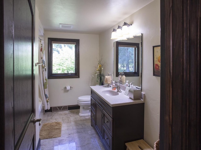 full bathroom featuring toilet, vanity with extensive cabinet space, tile flooring, and shower / bathtub combination with curtain