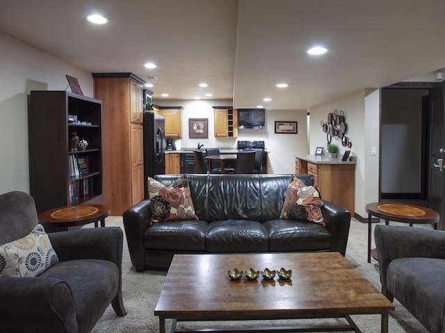 living room featuring light carpet