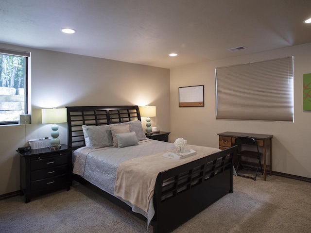 bedroom featuring light carpet