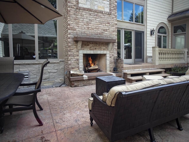 view of patio / terrace featuring an outdoor living space with a fireplace