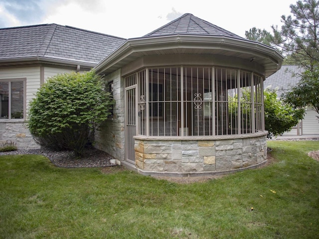 view of home's exterior with a yard