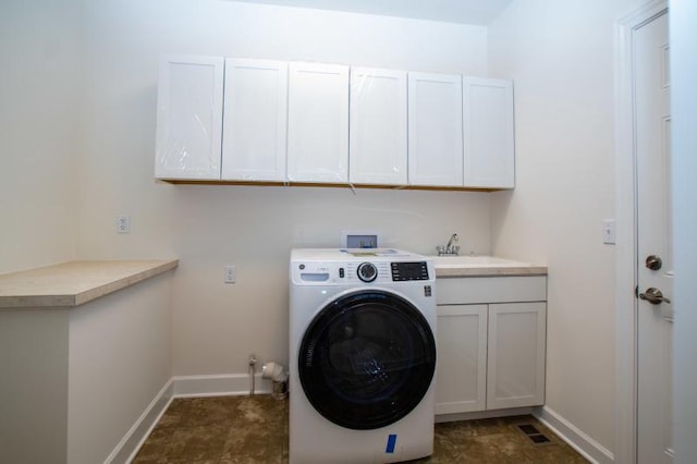 laundry room with sink, washer / clothes dryer, cabinets, and dark tile flooring