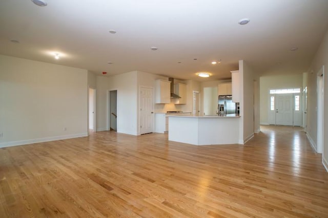 unfurnished living room featuring light wood-type flooring