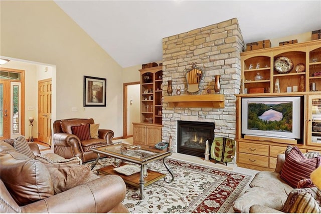 living room featuring high vaulted ceiling and a stone fireplace