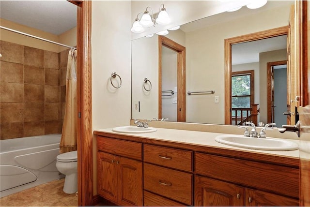 full bathroom featuring dual sinks, shower / bath combo with shower curtain, toilet, tile flooring, and large vanity