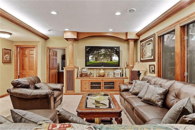 living room with decorative columns, carpet flooring, and a textured ceiling