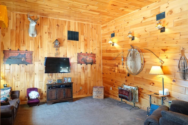 living room with wood ceiling, wooden walls, and dark carpet