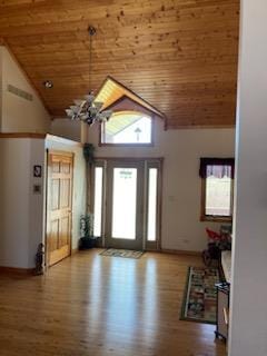 entryway with wooden ceiling, high vaulted ceiling, and wood-type flooring