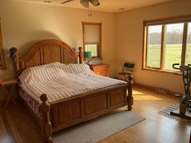 bedroom featuring ceiling fan and light wood-type flooring