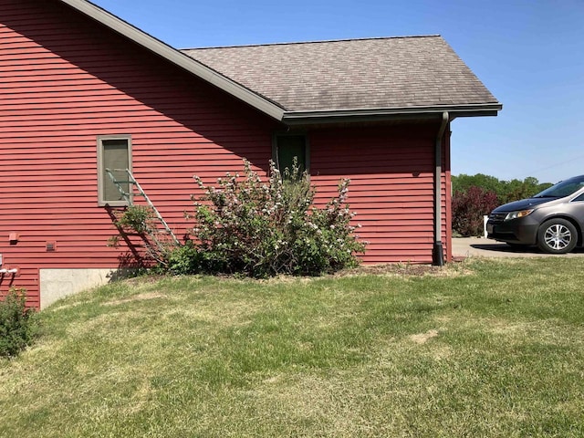 view of property exterior featuring a lawn