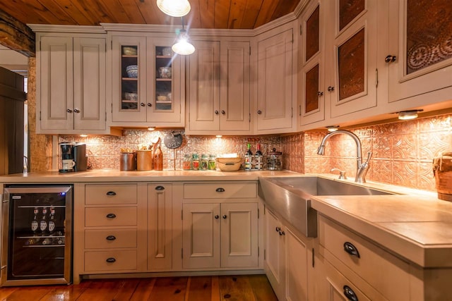 kitchen featuring wood ceiling, white cabinets, dark hardwood / wood-style floors, and wine cooler