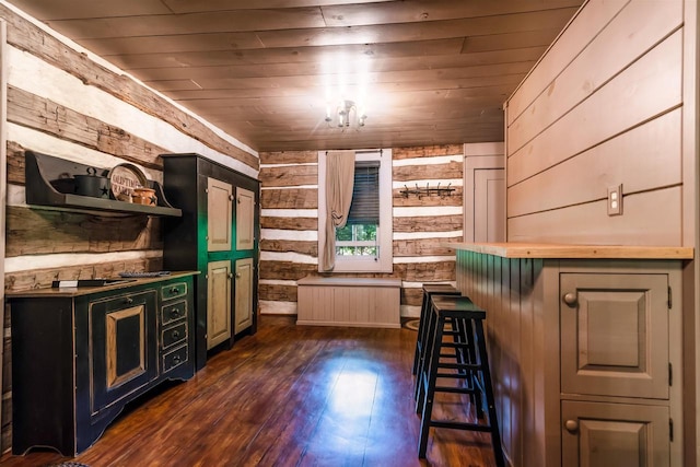 interior space with wooden ceiling, wood walls, and dark wood-type flooring