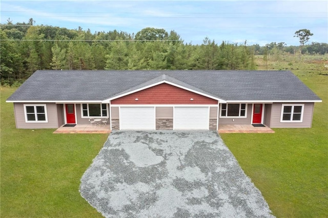 ranch-style home featuring a front lawn, a garage, and a porch