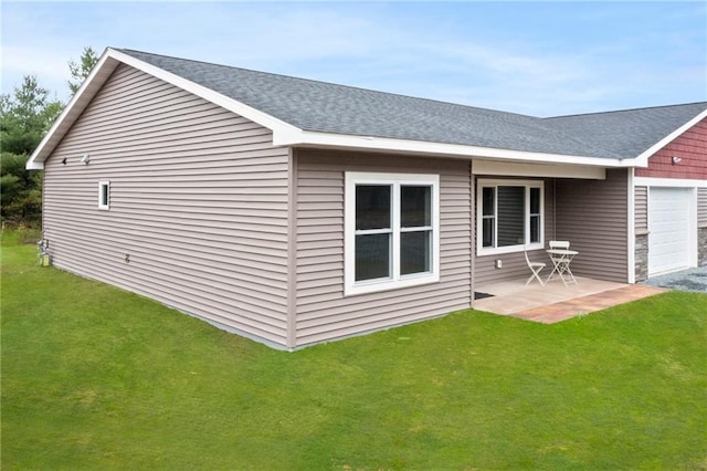 rear view of property featuring a patio and a yard