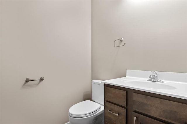 bathroom with toilet and vanity