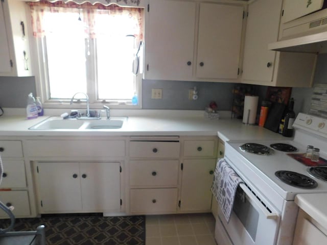 kitchen featuring sink, light tile floors, electric range, white cabinets, and backsplash