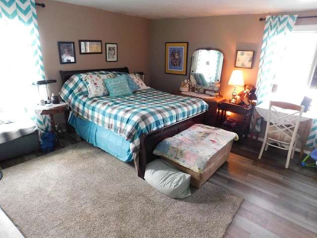 bedroom featuring dark hardwood / wood-style flooring