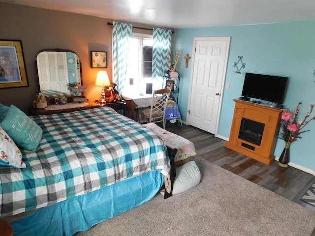 bedroom featuring dark wood-type flooring