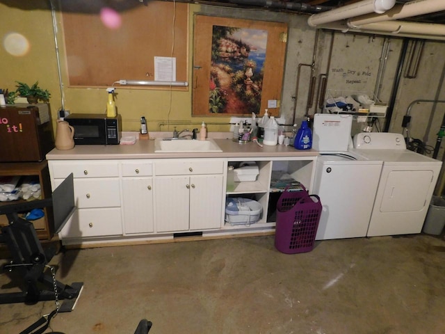 interior space featuring separate washer and dryer and sink