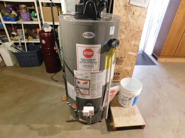 utility room featuring gas water heater