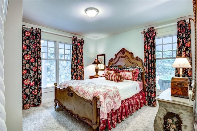 bedroom with light colored carpet