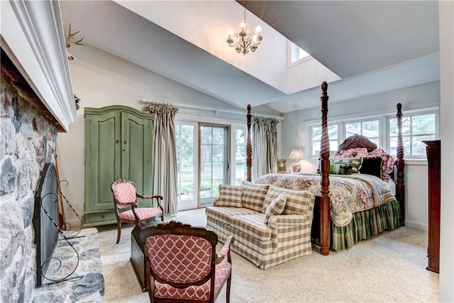 carpeted bedroom with multiple windows, a chandelier, and vaulted ceiling