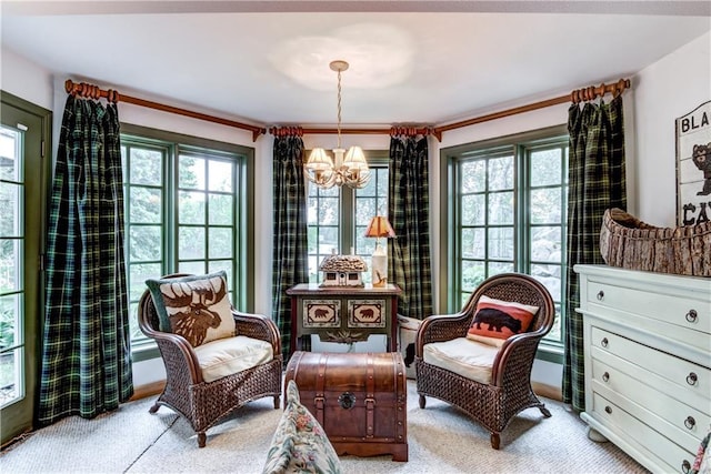 living area with an inviting chandelier