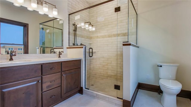 bathroom featuring toilet, double sink, vanity with extensive cabinet space, walk in shower, and tile flooring