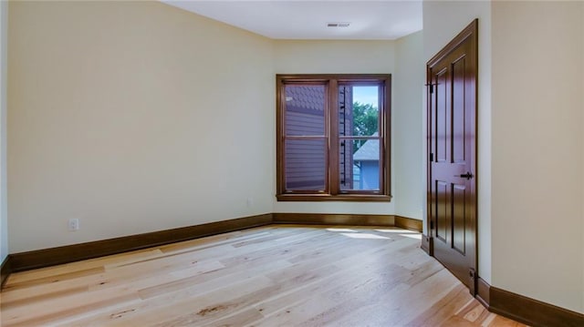 empty room with light wood-type flooring