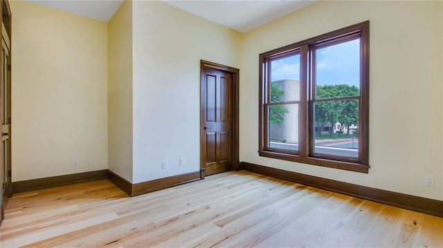 unfurnished room with light hardwood / wood-style floors