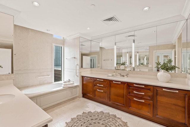 bathroom with tile floors, vanity, and a bath to relax in