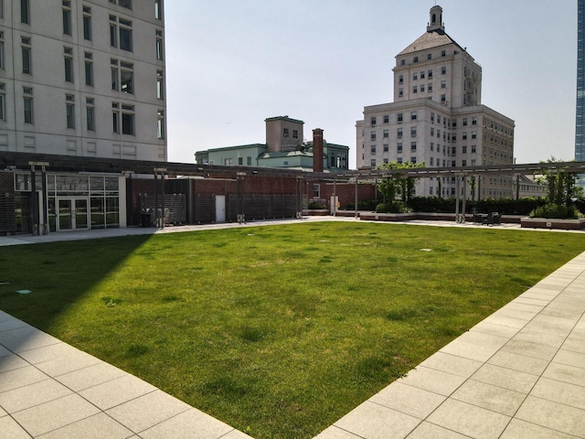 view of property's community with a lawn