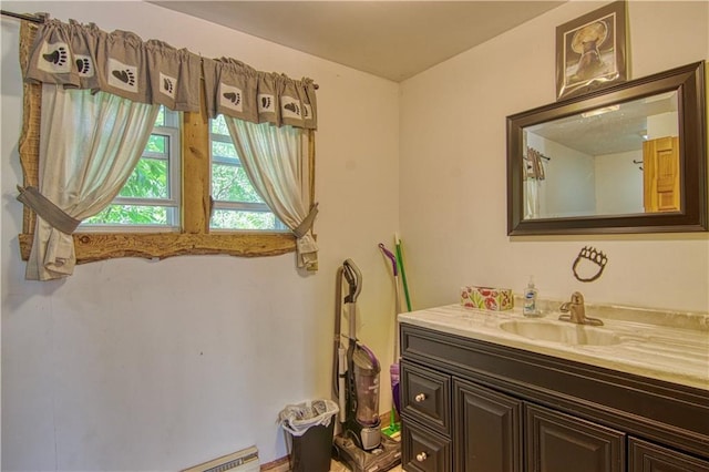 bathroom featuring vanity with extensive cabinet space