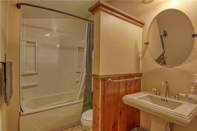 full bathroom with sink, shower / bath combination with curtain, tile flooring, and toilet