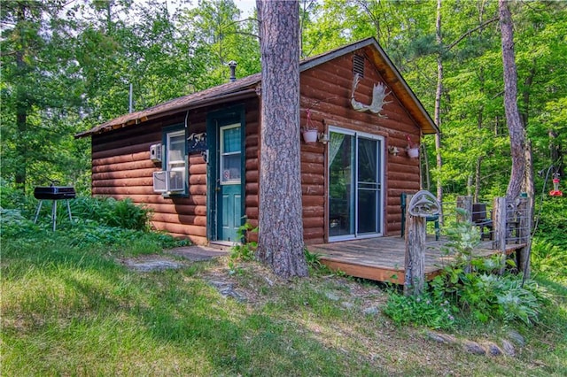 view of side of home with a wooden deck