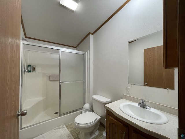 bathroom featuring toilet, vanity, walk in shower, ornamental molding, and tile floors