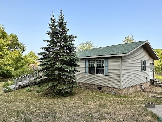 view of home's exterior with a wooden deck