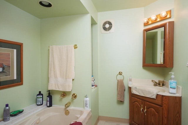 bathroom featuring tile flooring, vanity, and a bathtub