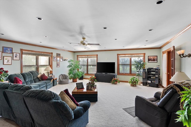 living room featuring light carpet, crown molding, and ceiling fan